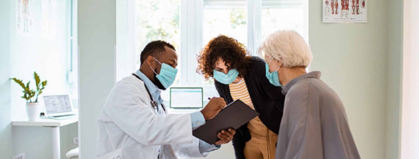 Close up of a senior woman and her daughter having a doctors appointment