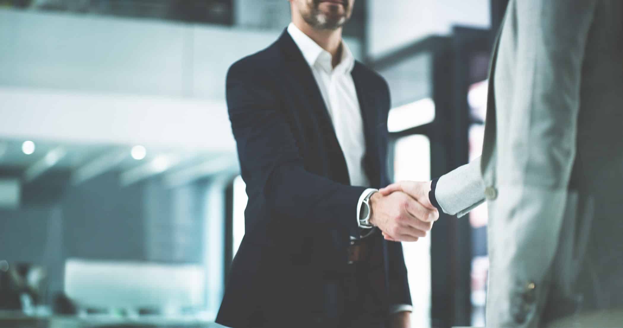 Two Businesses men shaking hands